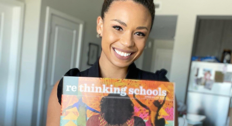 CKJ RS Cierra Kaler-Jones holding up an issue of Rethinking Schools Magazine