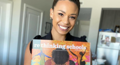 CKJ RS Cierra Kaler-Jones holding up an issue of Rethinking Schools Magazine